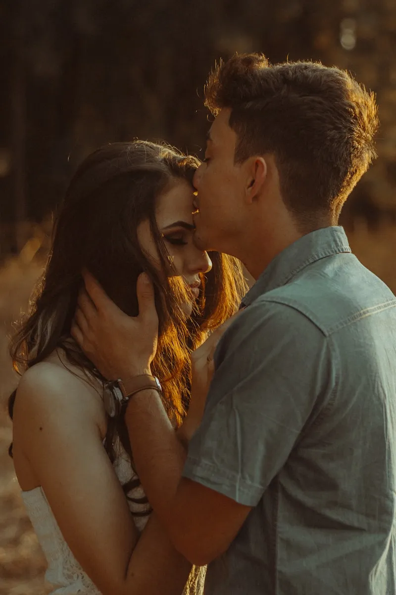 A couple sharing a quiet, romantic moment at golden hour